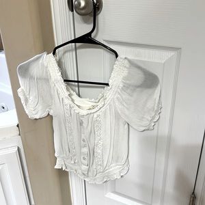 Slightly off white crop top. Size small.